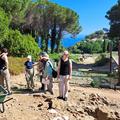 Students listening at an archaeological site