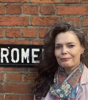 Lorraine Laird standing by a sign called 'Rome'